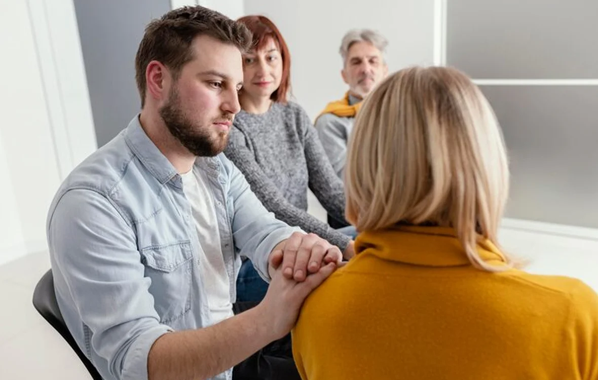 Family smiling together during a therapy session
