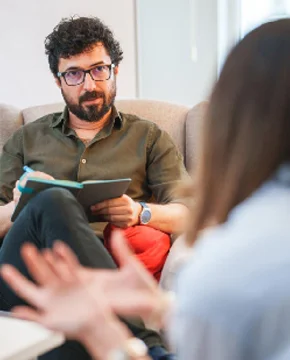 Therapist and client having a warm conversation