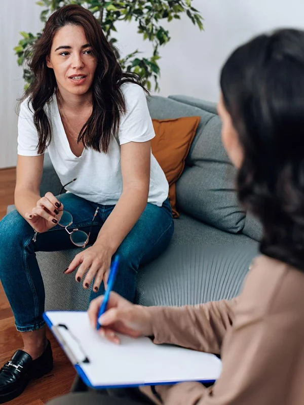 Young person reflecting in a therapy setting